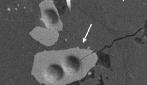 A lunar zircon grain under a microscope. Credit: Jennika Greer